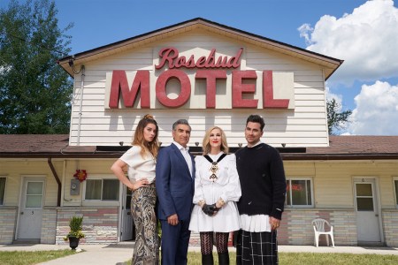 The actors of "Schitt's Creek" in front of the Rosebud Motel