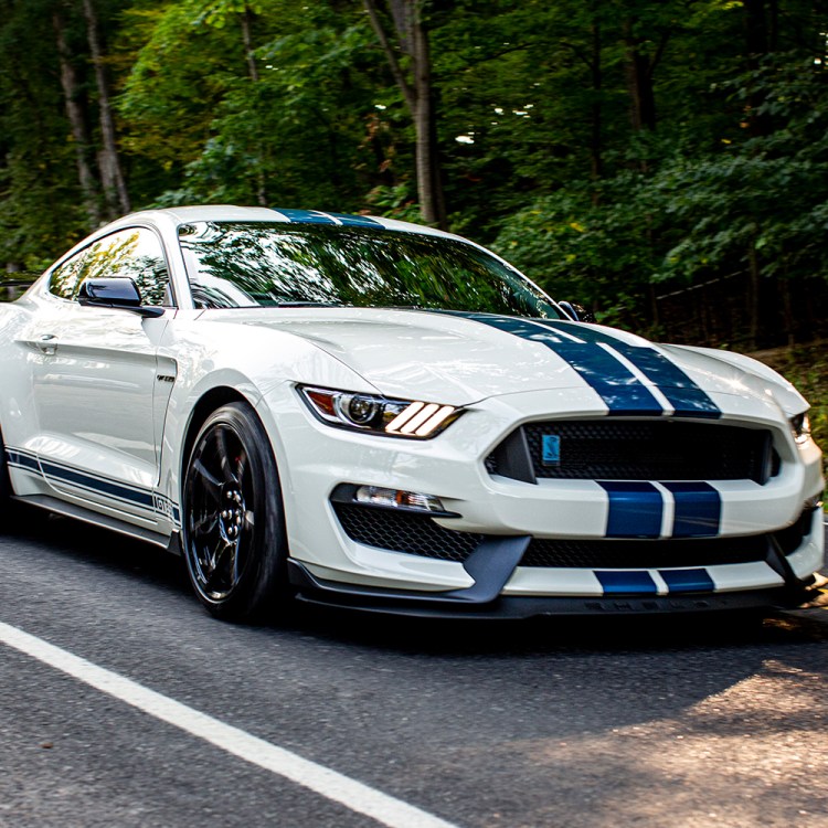 The 2020 Ford Mustang Shelby GT350R Heritage Edition in white and blue on the road