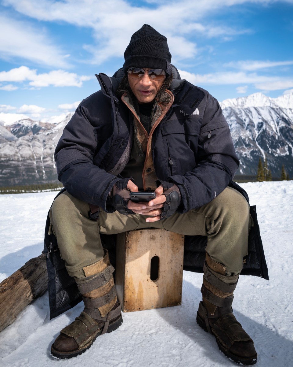 “This photo was from <em>Jumanji: The Next Level</em>. We were at the top of a mountain in Calgary and I just love the juxtaposition,” Garcia says. “It was really cold. It was hard to find reception. We were setting up the cameras and still had to get some work done. And he was working on his phone checking emails. He just never stops. The scenery was beautiful. I just love the backdrop of him deep into thought and this unbelievable backdrop behind him. It doesn't matter where you are, there's always an opportunity to get some work done. It's one of the things I most admire about him. He may have 200 million social media followers on Instagram alone, but he's the guy who's running the Instagram. No matter how big the business or the enterprise he’s working with might be, he's always going to keep his two hands in there. I think that's what keeps everything as authentic as it is.”