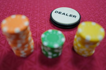 Poker gaming chips stand on a table during a casino training session in France.