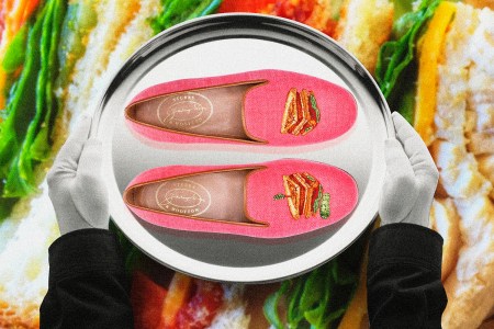 Butler holding a silver serving tray