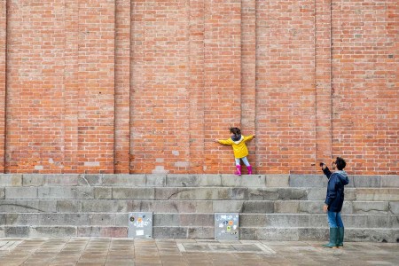 girl in a yellow raincoat in venice
