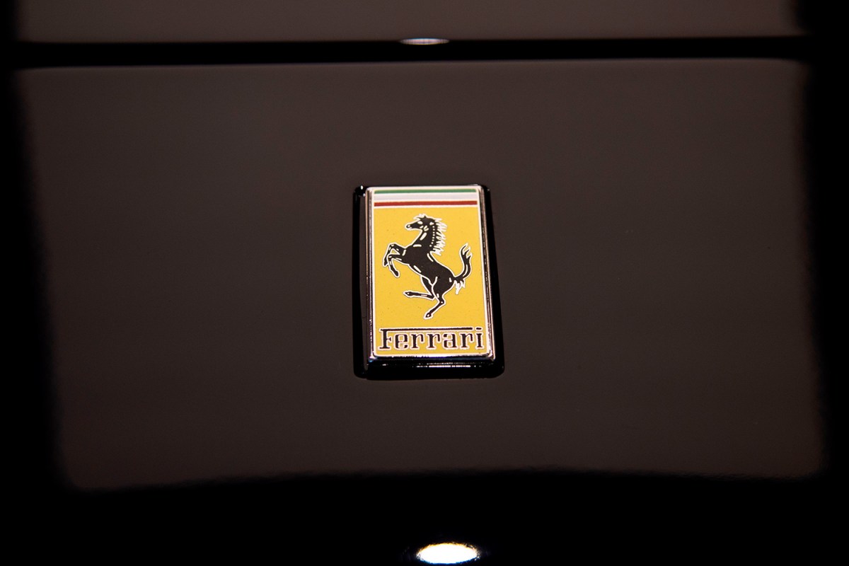 Ferrari logo on black sports car