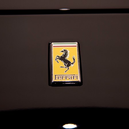 Ferrari logo on black sports car