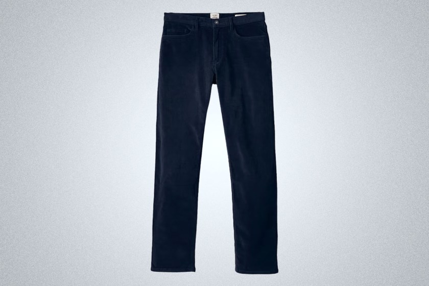 a pair of dark blue cords on a grey background