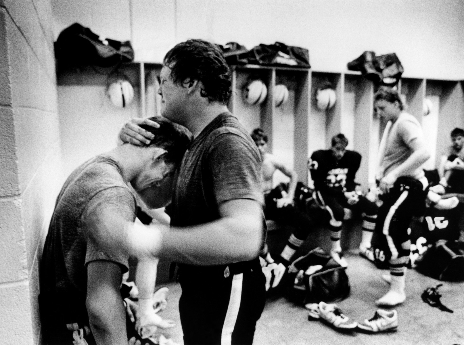 Jerrod McDougal embraces Greg Sweatt and punches the wall in the locker room following the loss to Midland Lee.<br><br>“Jerrod was smashing the wall and crying after the loss,” Clark says. “He was very emotional and really one of my favorite players. I just always liked him. He wasn't the most talented player, but he played with a lot of heart. You have to realize that it was a national program in a lot of ways. There was a lot of pressure on these kids. The town depended on them, the school depended on them. It's kind of where they got a positive sense of their identity.”