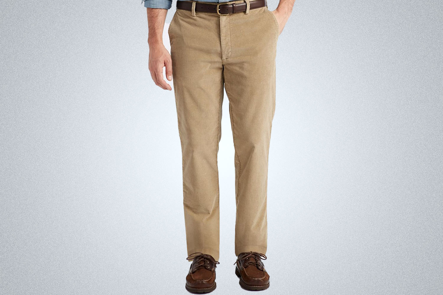 a model in a pair of biege L.L. Bean corduroy pants on a grey background