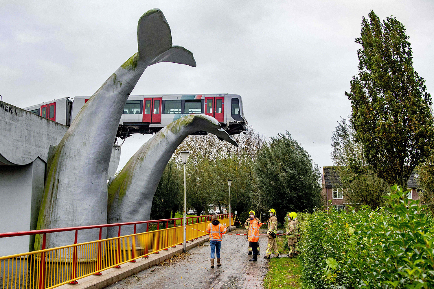 Whale tail sculpture saves train