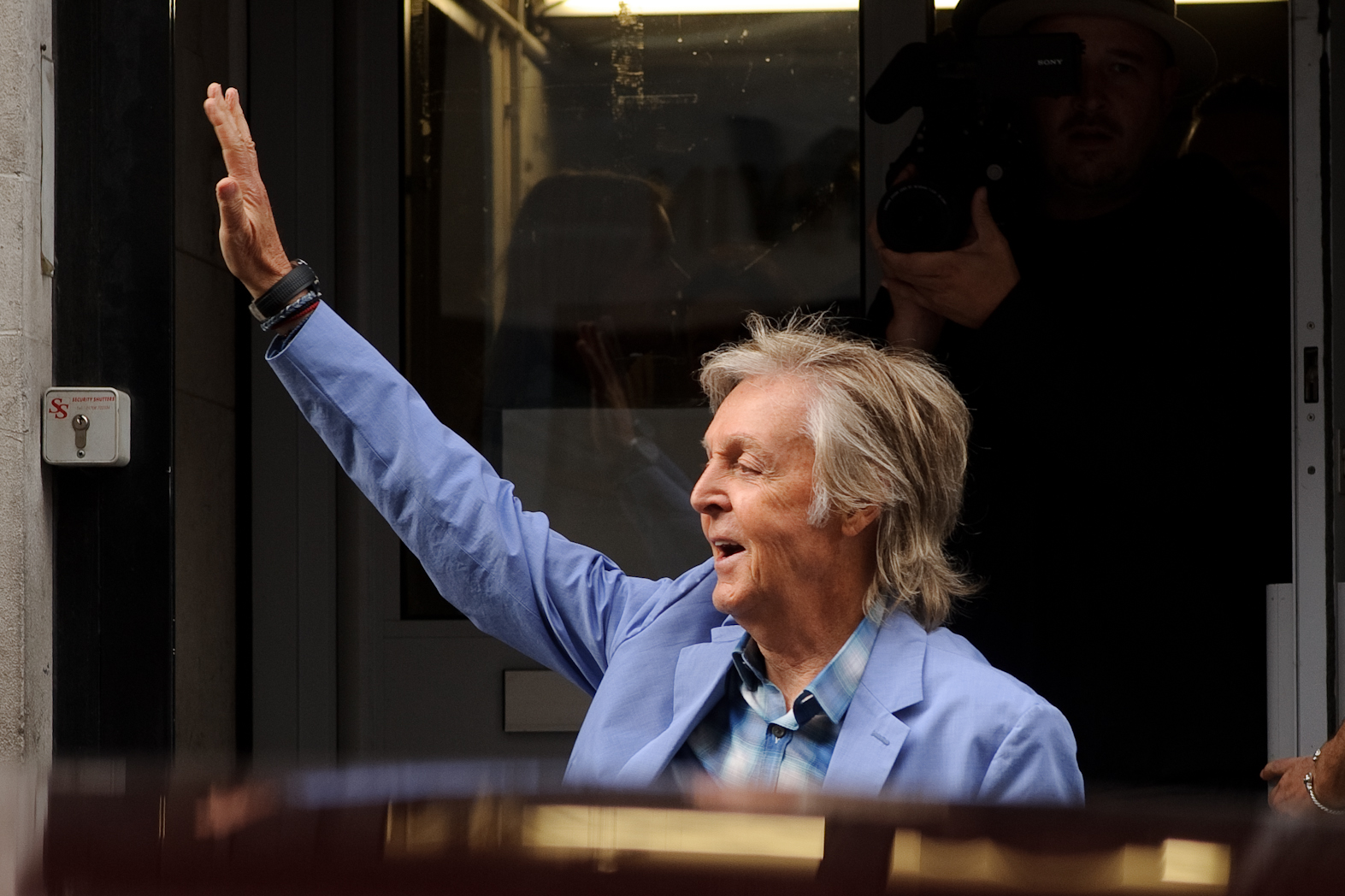 Paul McCartney waving