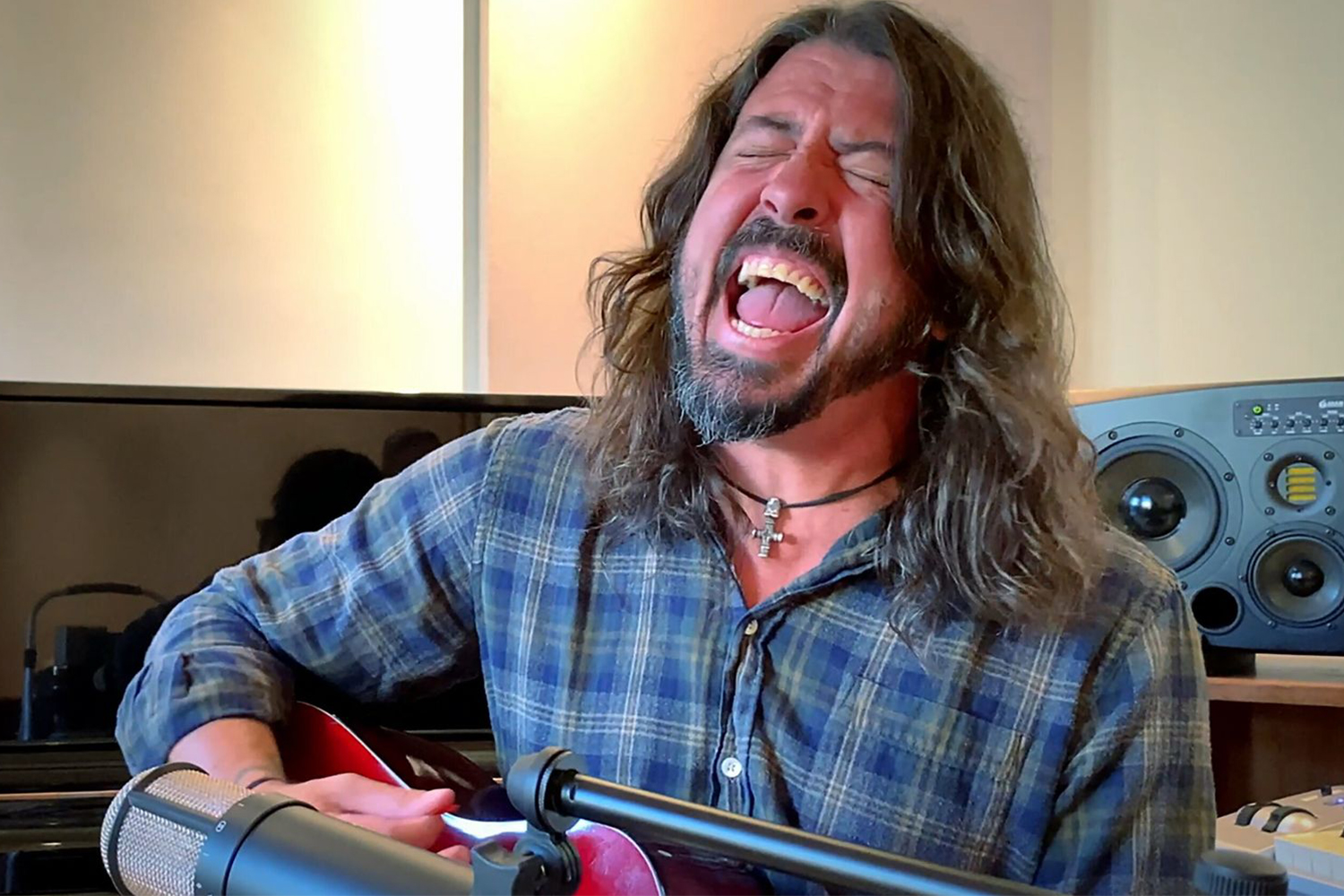 Dave Grohl playing guitar at home