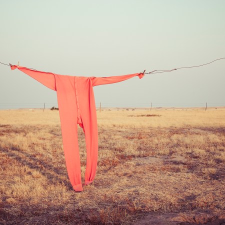 Red union suit on clothing line