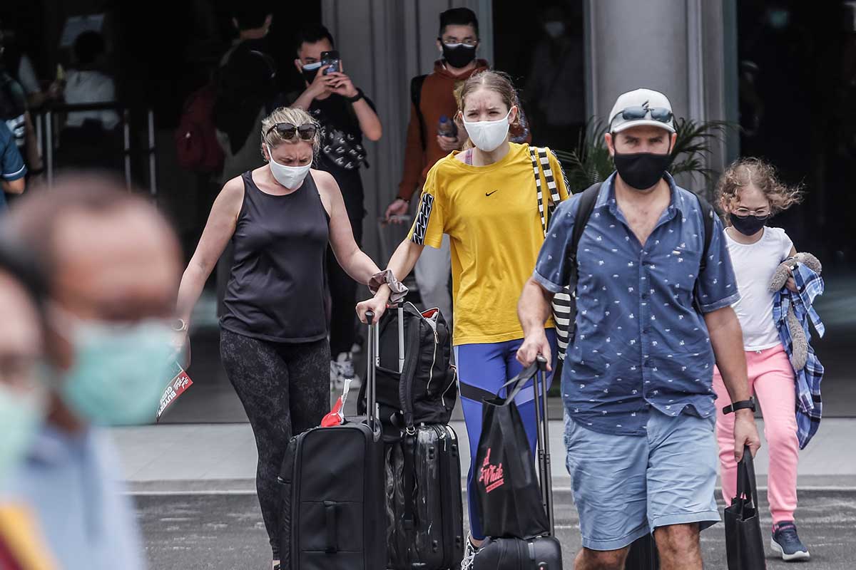 Bali tourists wearing masks