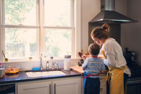 child cooking with parent