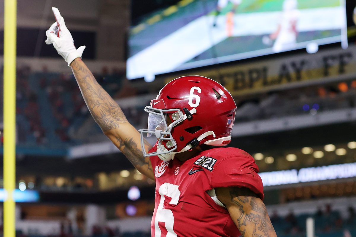 DeVonta Smith of the Alabama Crimson Tide celebrates a touchdown  at College Football Playoff National Championship game.