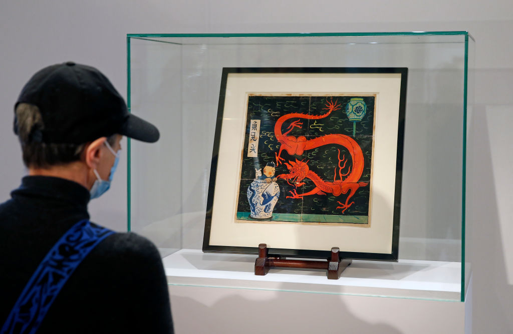 Cover Of The 1936 Album Le Lotus Bleu By Herge Is Displayed At Artcurial Auction House In Paris