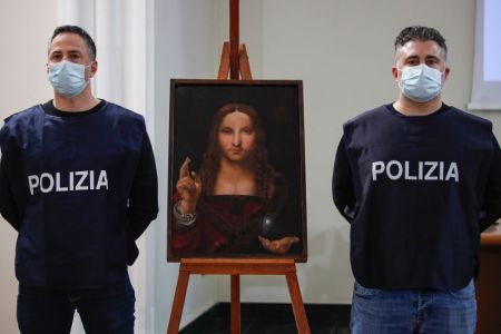 Policeman show the "Salvator Mundi", a painting from the