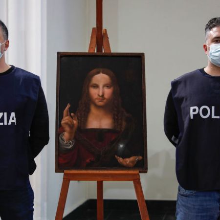 Policeman show the "Salvator Mundi", a painting from the