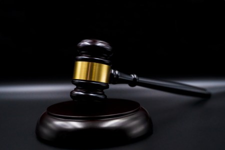 Wooden court gavel on black background