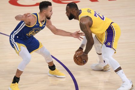 LeBron James drives on Stephen Curry