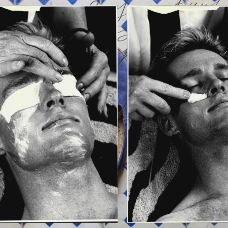 A man with lotion on his face.