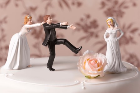 brides fighting over groom cake topper