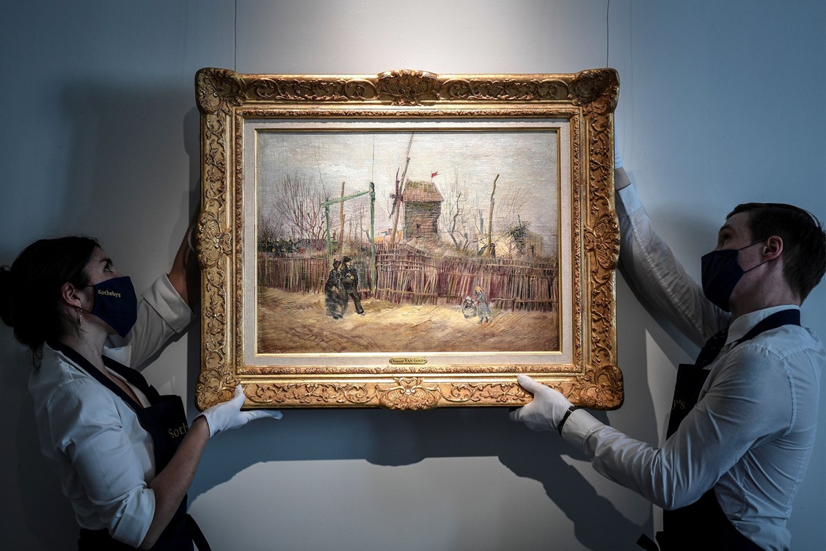 Displaying "Scene de rue a Montmartre (Impasse des deux freres et le moulin à Poivre)," 1887 by Dutch painter Vincent Van Gogh, at the Sotheby's auction house in Paris.