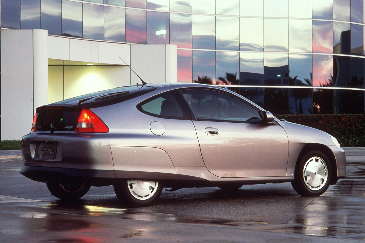The back end of the 2000 Honda Insight hybrid in silver