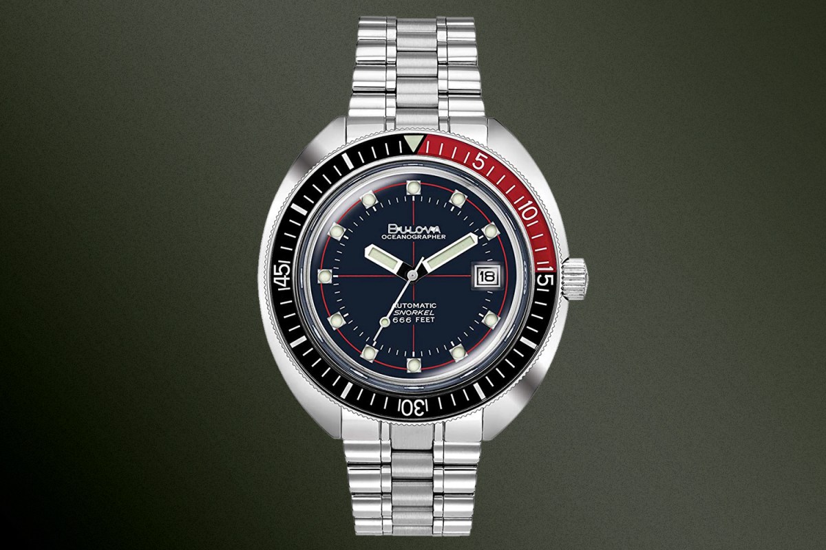 A Bulova Oceanographer Devil Diver watch in red and black on a green background