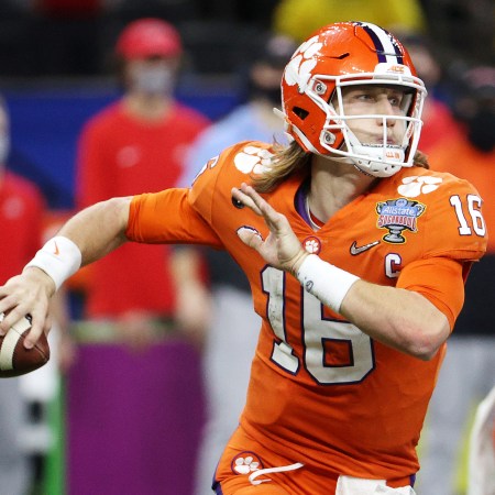 Trevor Lawrence of the Clemson Tigers looks to pass in the second half against the Ohio State Buckeyes during the College Football Playoff semifinal game at the Allstate Sugar Bowl at Mercedes-Benz Superdome on January 01, 2021 in New Orleans, Louisiana.