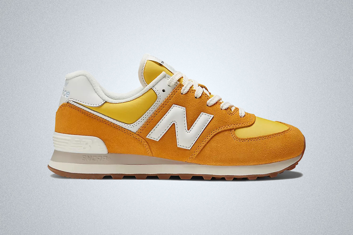 an orange NB shoes 574 on a grey background