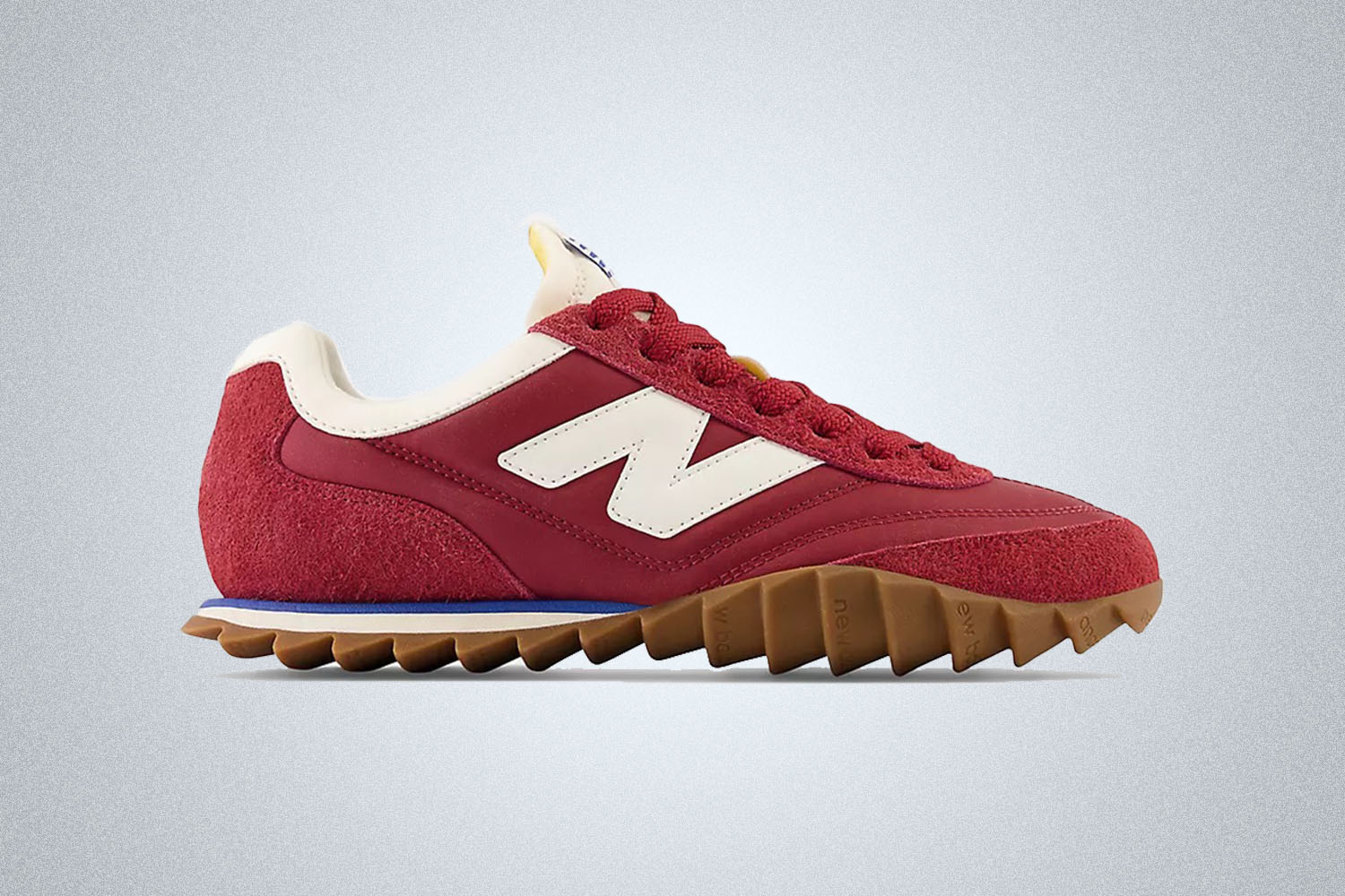 A red New Balance RC30 on a grey background