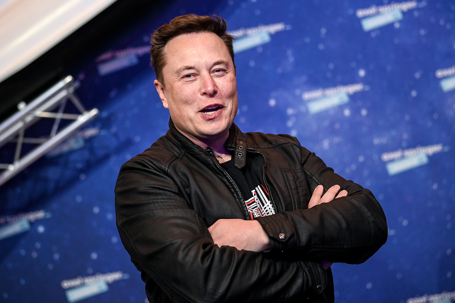 Tesla and SpaceX CEO Elon Musk smiles and folds his arms
