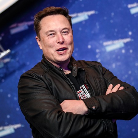 Tesla and SpaceX CEO Elon Musk smiles and folds his arms