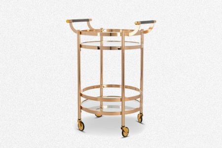 The gold Cosmo Bar Cart from Apt2B on a grey background
