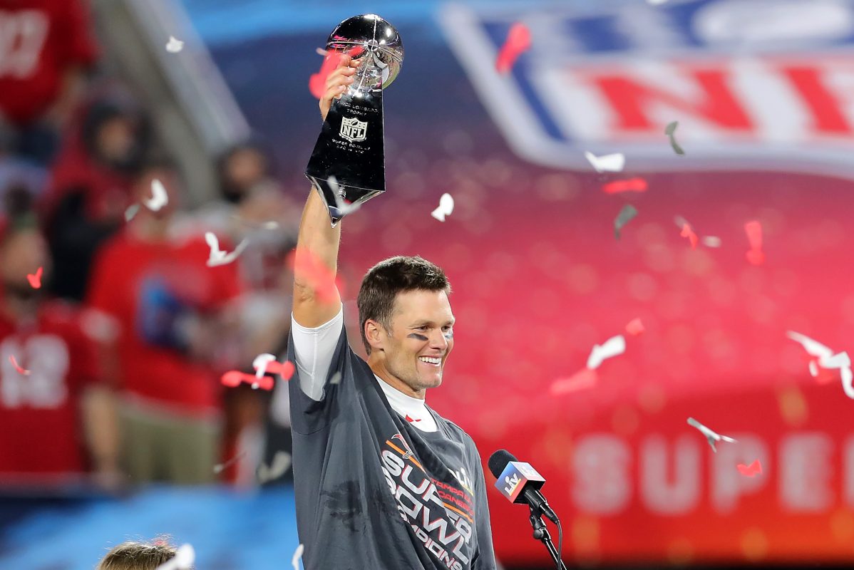 Super Bowl MVP Tom Brady holds up the Lombardi Trophy after winning Super Bowl LV