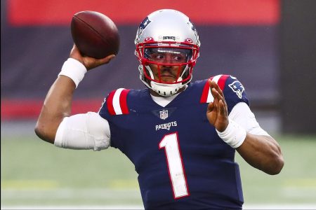 Cam Newton tries to throw