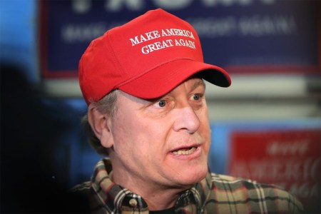 Former Boston Red Sox pitcher Curt Schilling in a red Make America Great Again hat