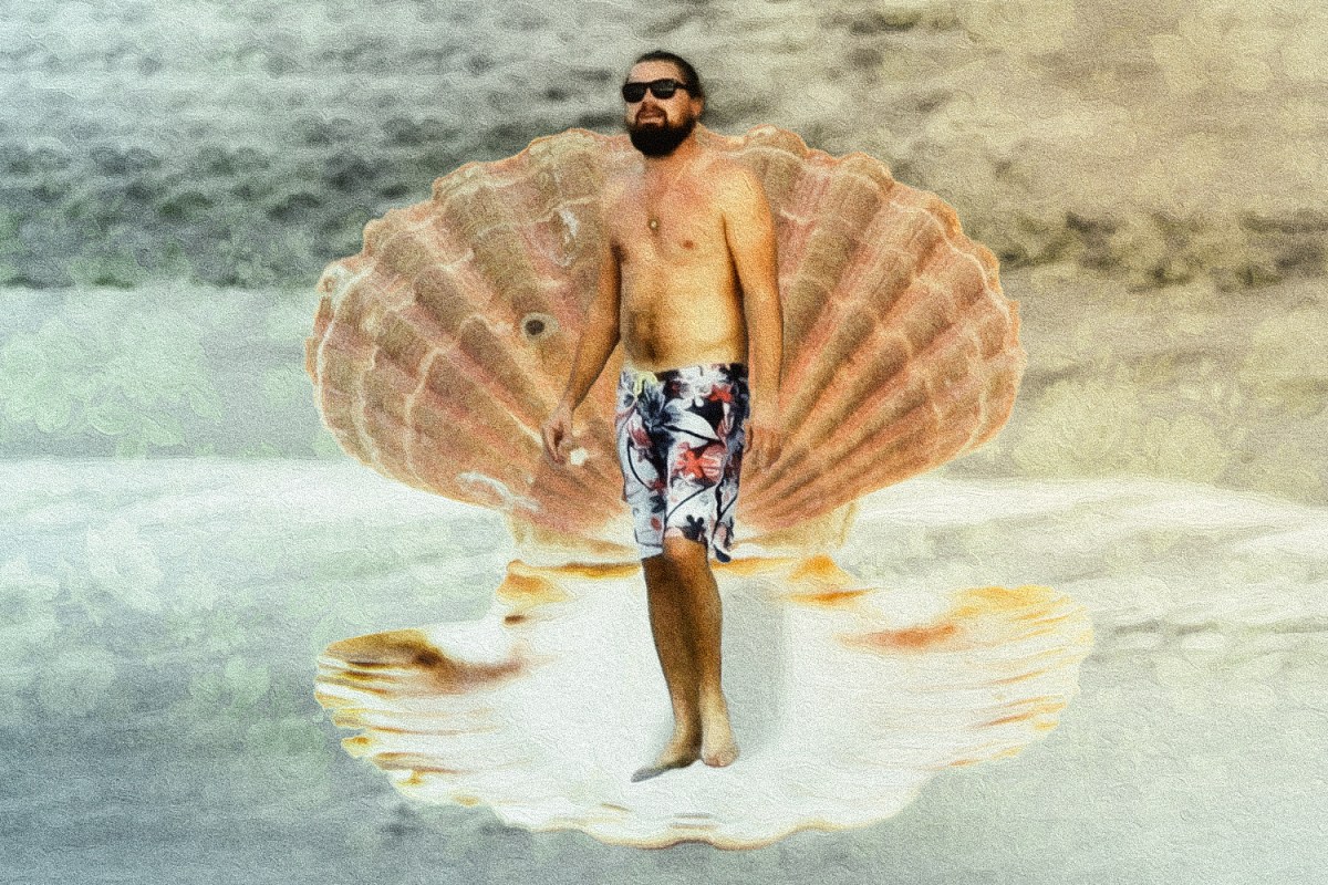 Leonardo DiCaprio in a swimsuit standing in a giant seashell