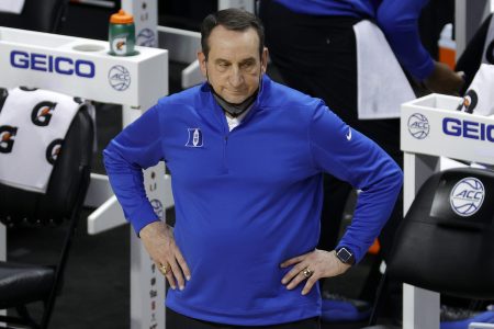 Head coach Mike Krzyzewski of the Duke Blue Devils with his hands on his hips