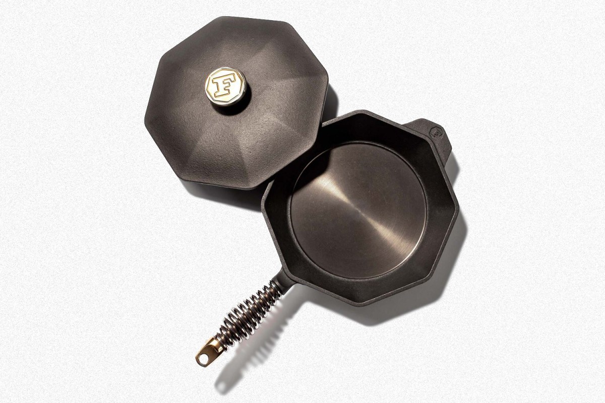 A Finex cast iron skillet with a lid on a white background