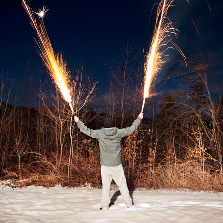 person holding fireworks in both hands