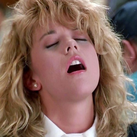 still from When Harry Met Sally shows Meg Ryan playing Sally Allbright faking an orgasm