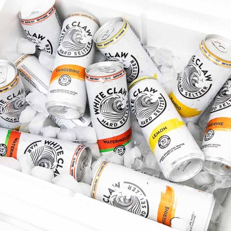 The different flavors of White Claw hard seltzer in a cooler