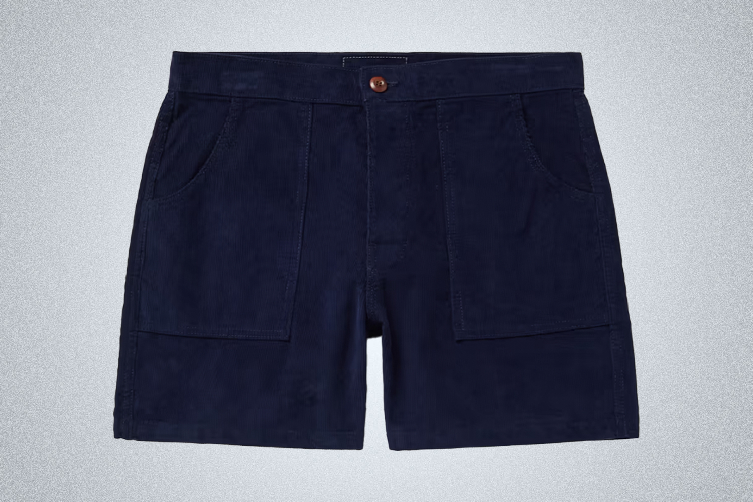 a pair of navy Birdwell Britches corduroy shorts on a grey background
