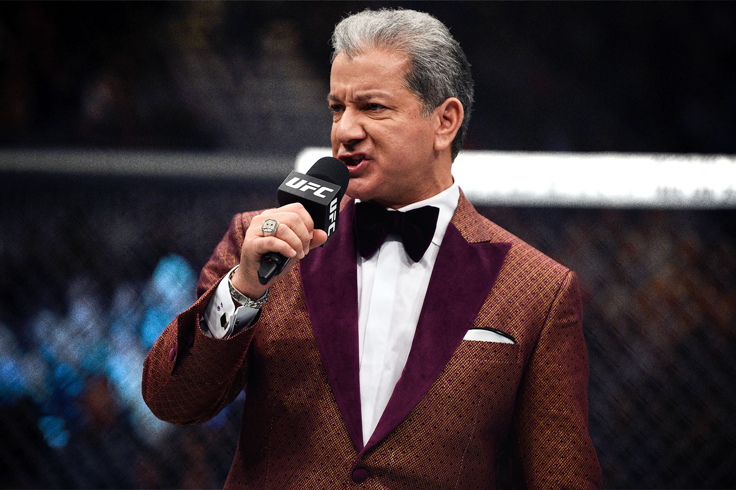 Bruce Buffer announcing a UFC fight in a King & Bay smoking jacket
