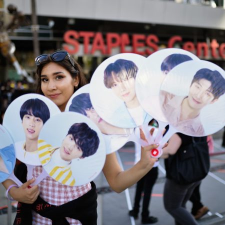A fan awaits the BTS concert as part of the "Love Yourself" North American Tour at Staples Center on September 9, 2018 in Los Angeles, California.