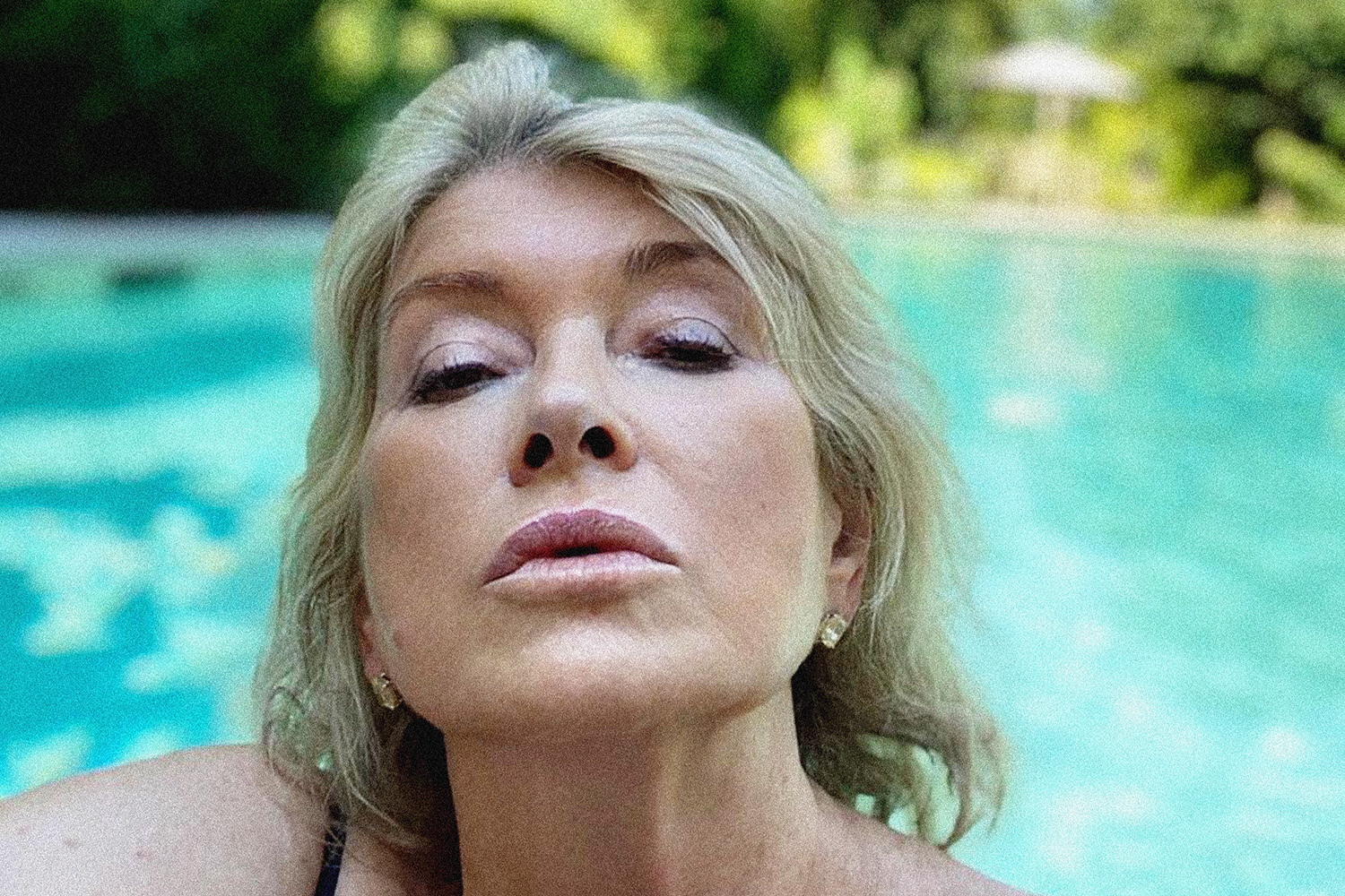 close-up photo of Martha Stewart's face, pool in the background.