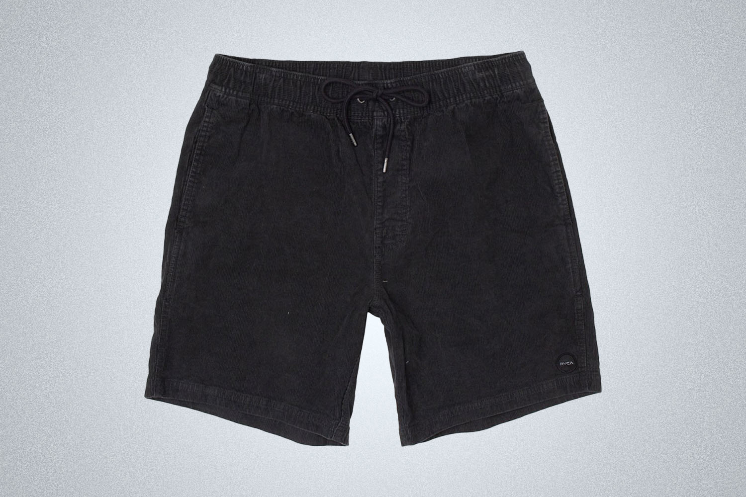 a pair of black RVCA corduroy shorts on a grey background