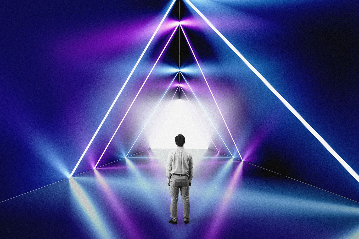 Rear view of man standing alone looking into space