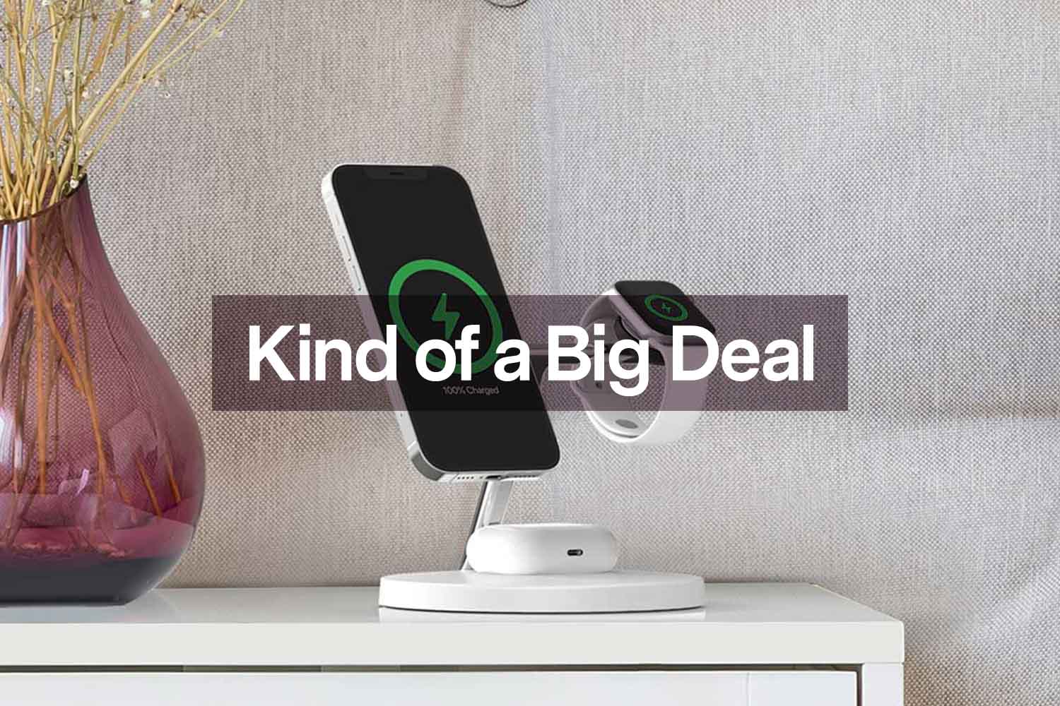 The Belkin MagSafe 3-in-1 Wireless Charger with three Apple devices charging, set on a table